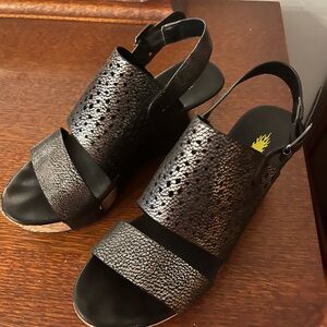 Volatile black wedge sandal